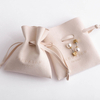 Forte beige bunched suede pouch jewelry bag 